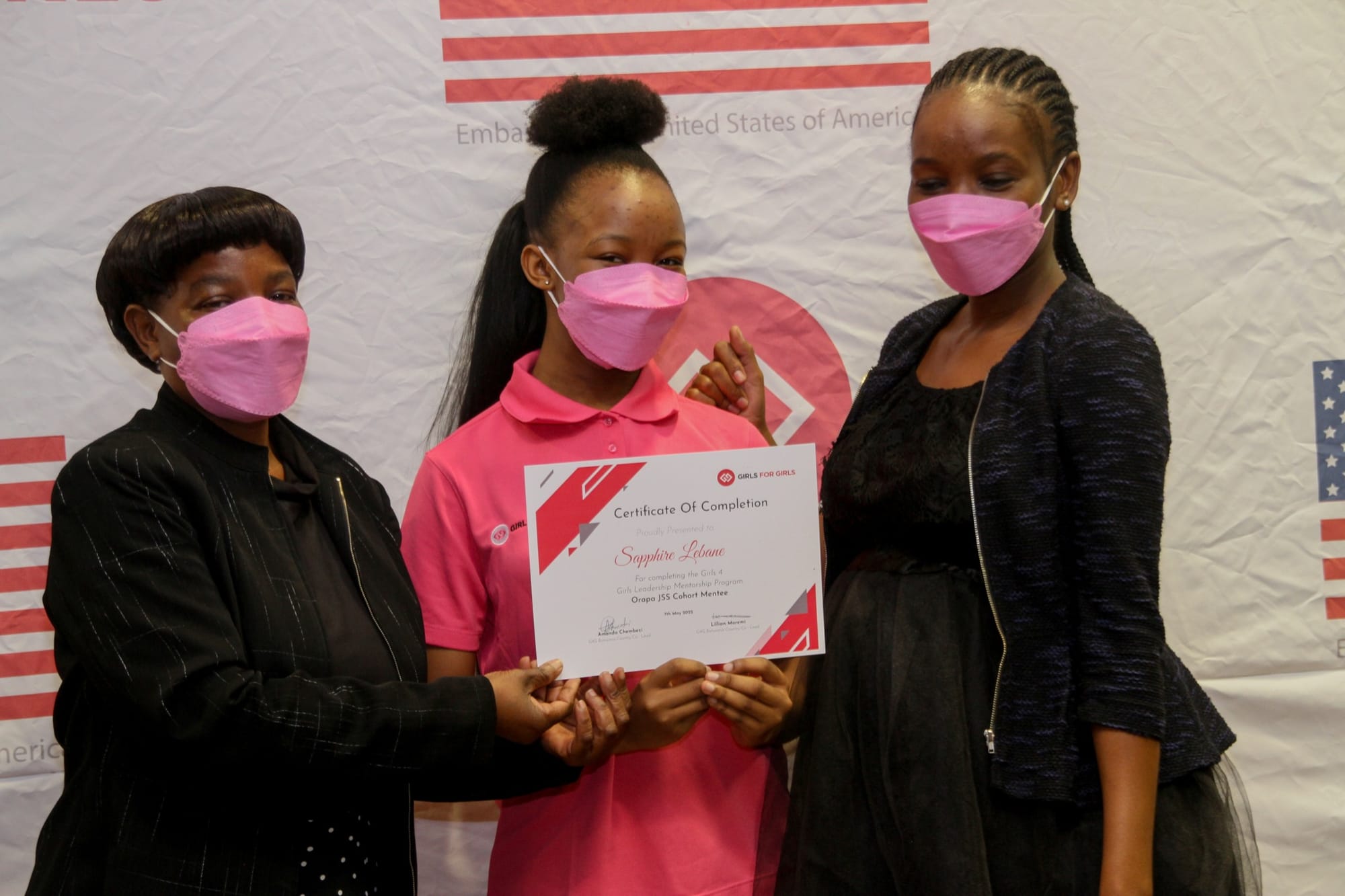 Photo of a G4G mentee receiving her certificate at the Graduation Ceremony